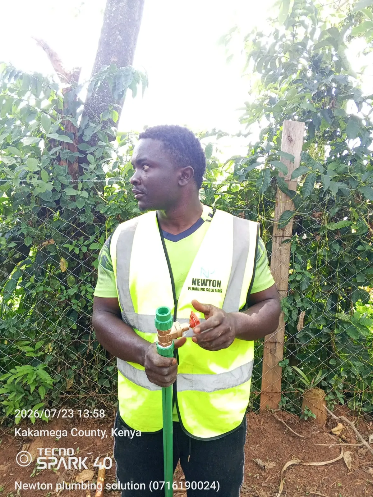 A Newton Plumbing Solution technician fitting a valve on site in Kakamega County